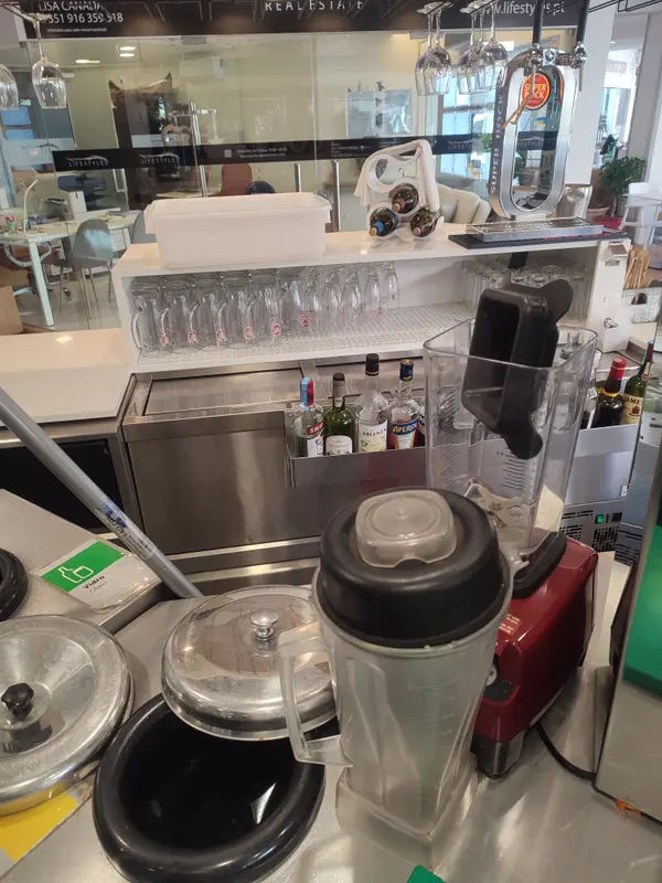 Bar Setup With Blender And Bottles