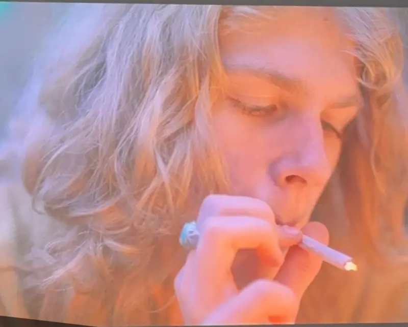 Blonde Smoking Rolled Cigarette