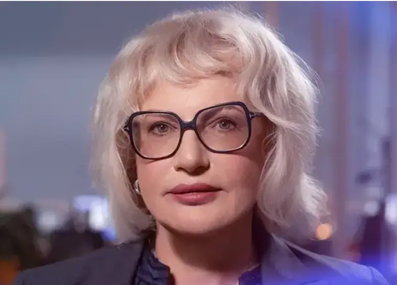 Blonde Woman With Glasses