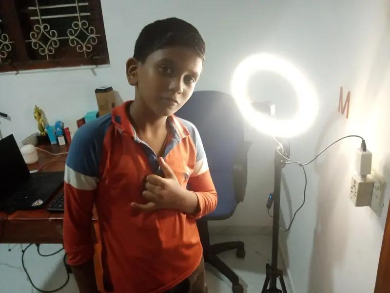 Boy Posing By Ring Light
