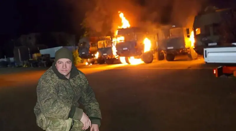 Burning Vehicles And Kneeling Person