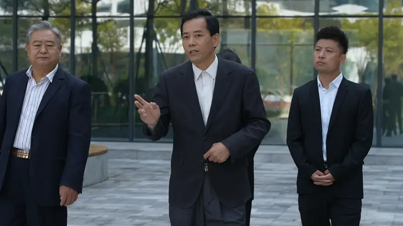 Businessmen Walking Outside Building