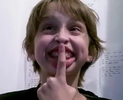 Child Making Playful Gesture