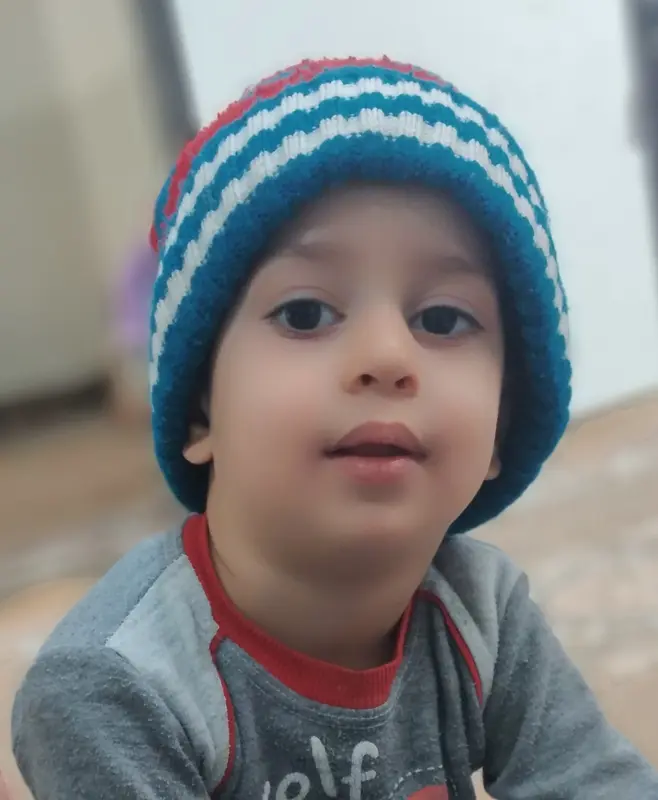 Child With Knitted Hat