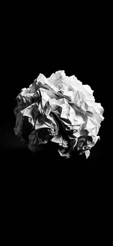 Crumpled Paper Ball On Black