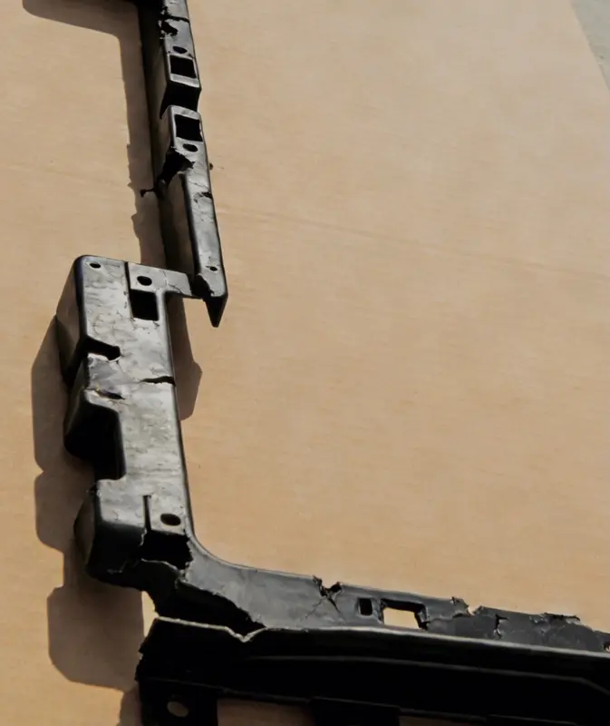 Damaged Black Plastic Component