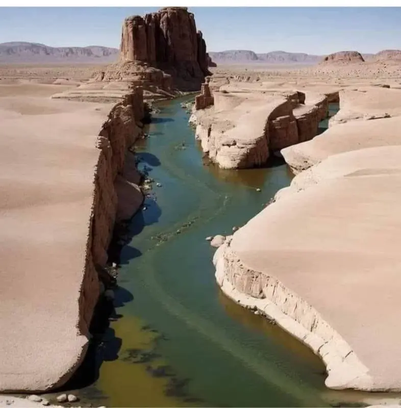 Desert River With Rocky Cliffs