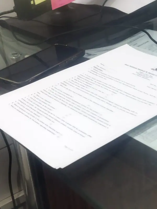 Documents On Glass Desk