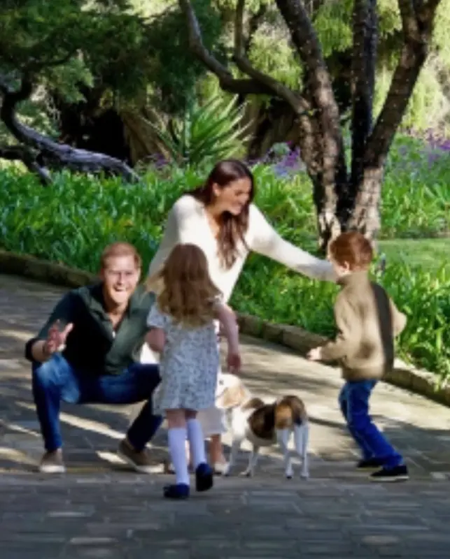 Family Playing In Garden