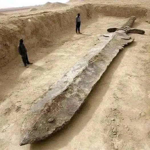 Giant Buried Sword In Sand