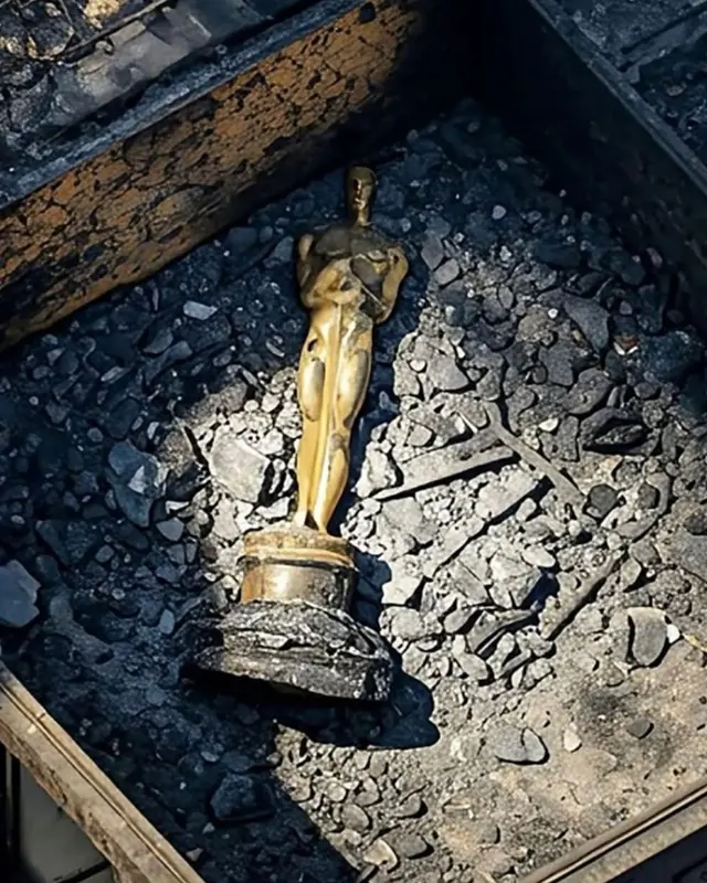 Golden Statue On Charred Debris