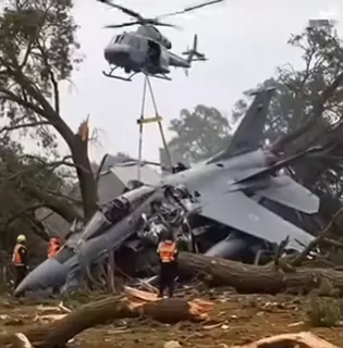 Helicopter Lifting Aircraft Wreckage