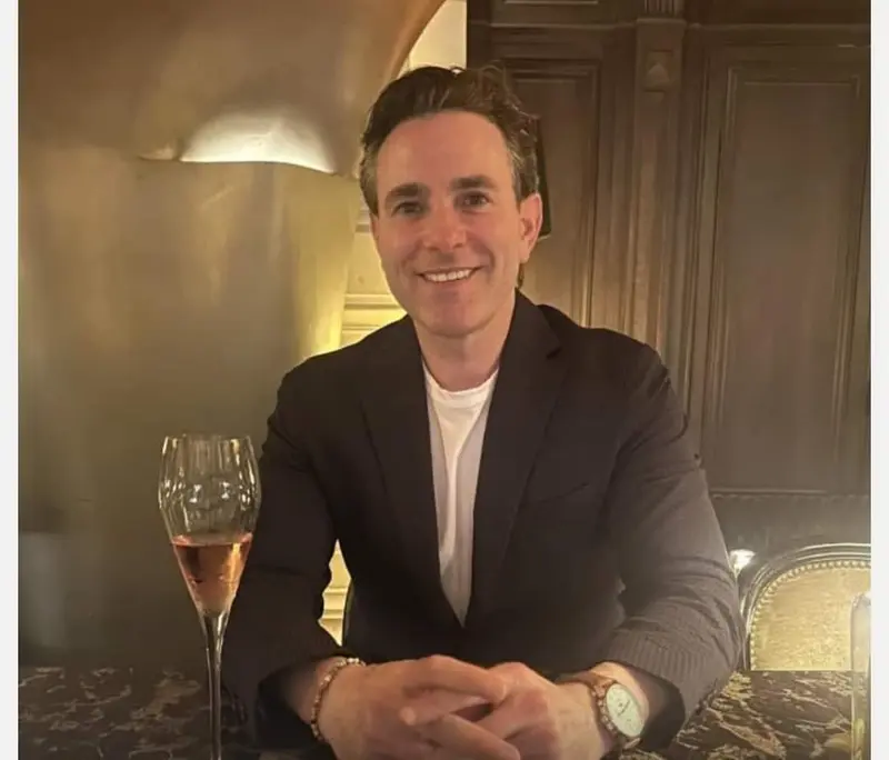 Man At Table With Wine