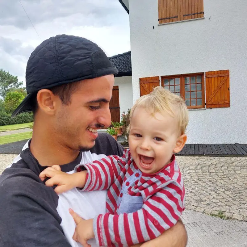 Man Holding Happy Baby