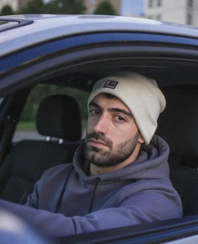 Man In Car With Beanie