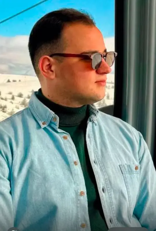 Man In Denim Shirt Gazing