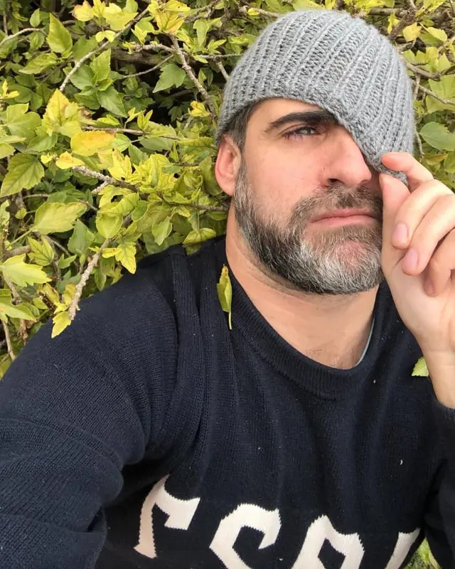 Man In Foliage With Beanie