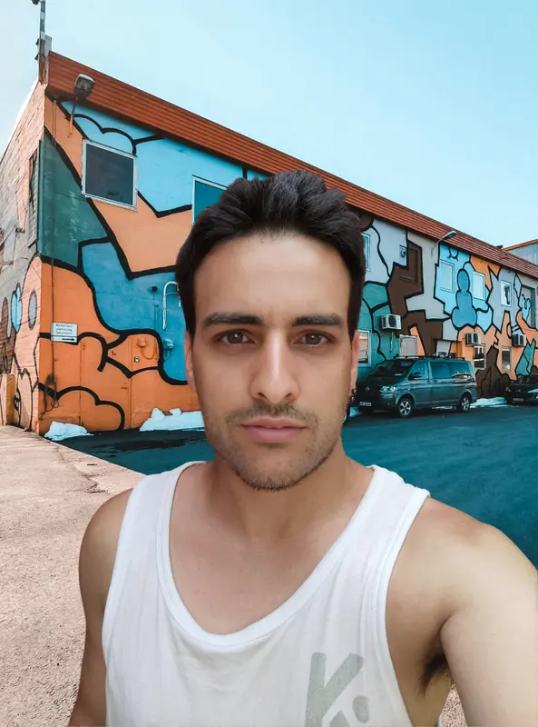 Man In Front Of Graffiti