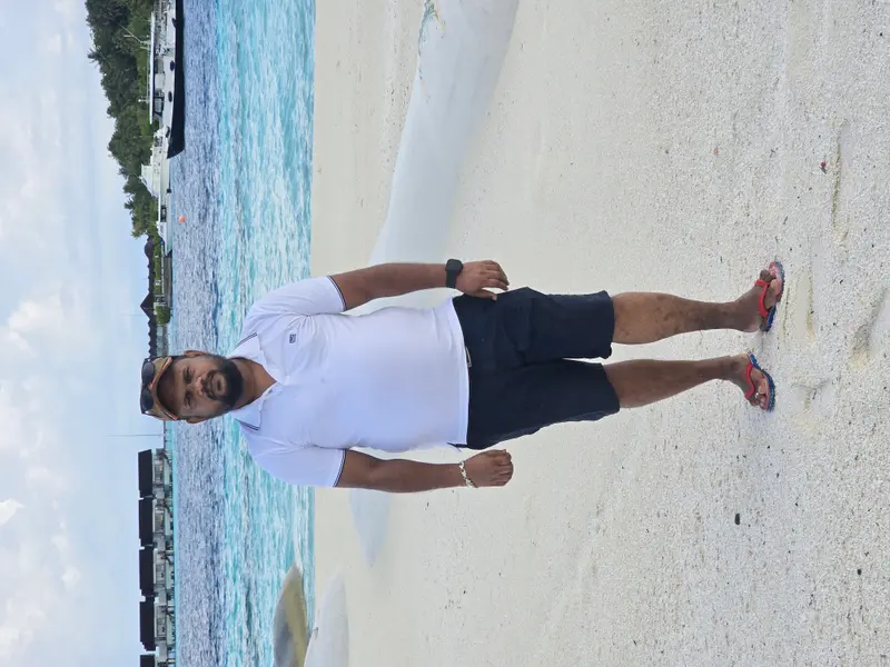 Man On Beach With Boats