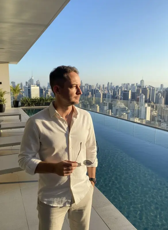 Man Overlooking City From Terrace