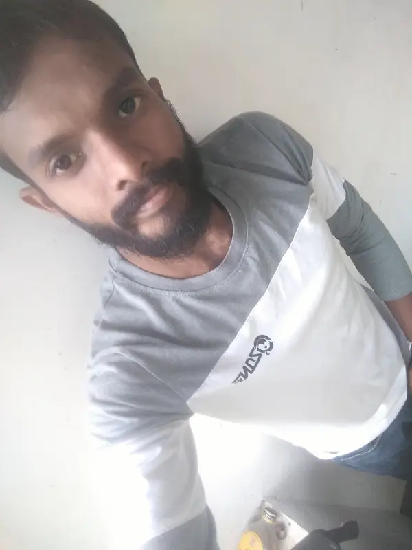 Man Posing Against Wall