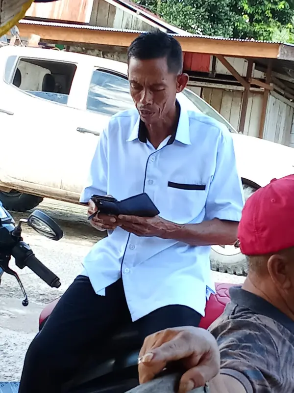 Man Reading On Motorcycle