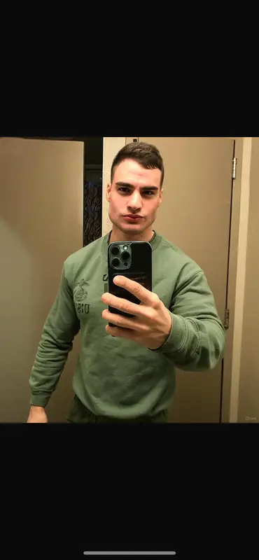 Man Taking Selfie In Bathroom