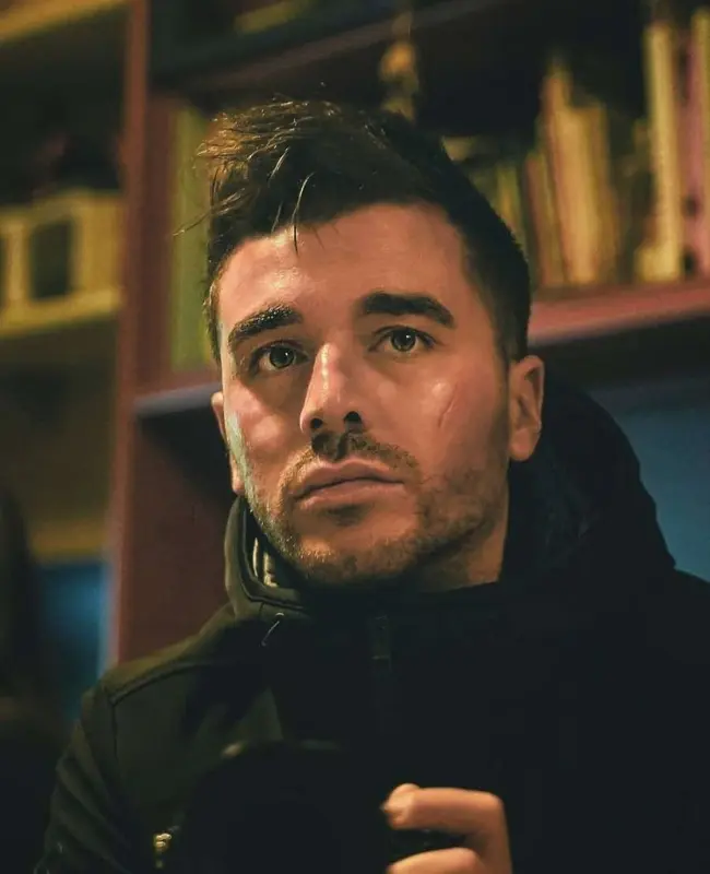 Man With Camera Indoors