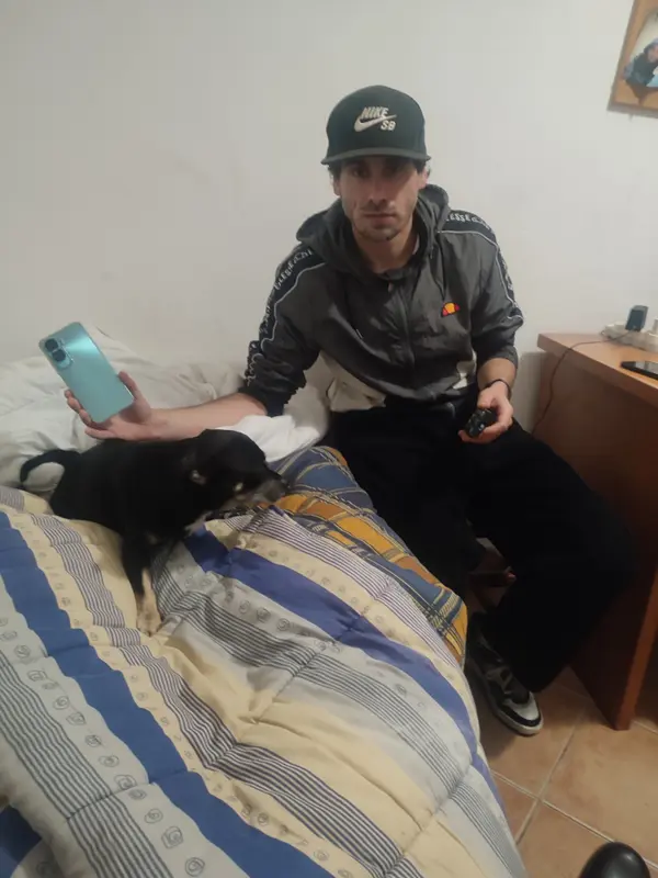 Man With Dog, Phone, Controller