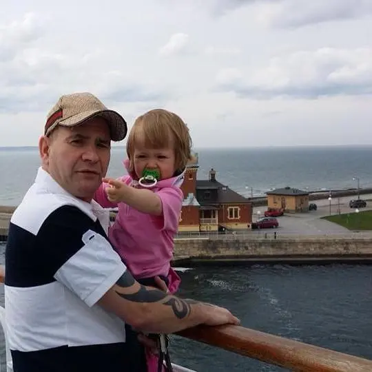 Man With Toddler By Waterfront