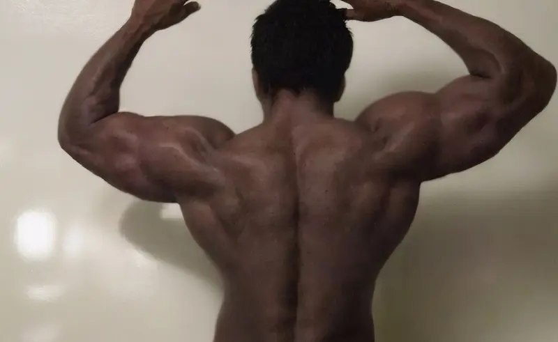 Muscular Man Flexing Back