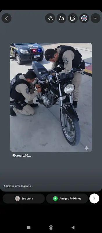 Officers Inspecting Black Motorcycle