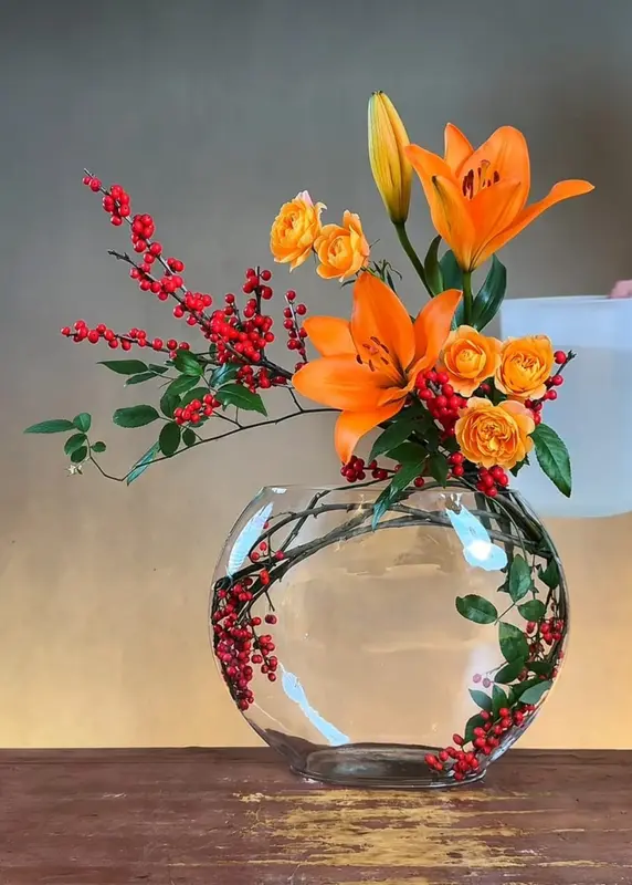 Orange Floral Arrangement In Glass