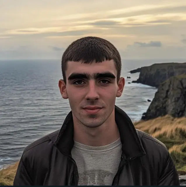 Person By Sea Cliffs