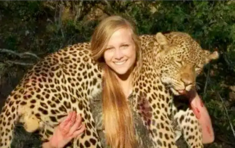 Person Carrying Leopard Outdoors