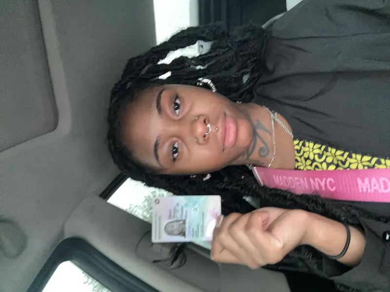 Person Displaying ID Card