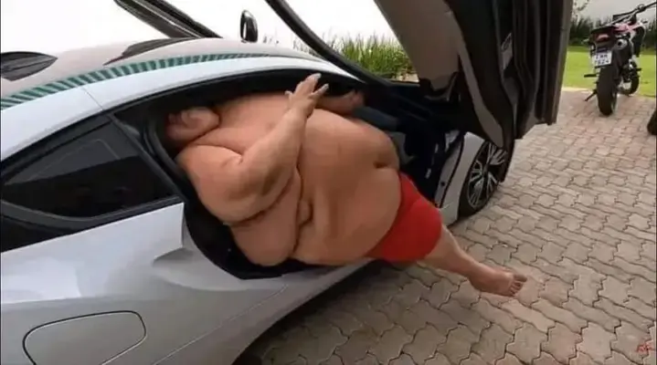 Person Exiting Small Sports Car