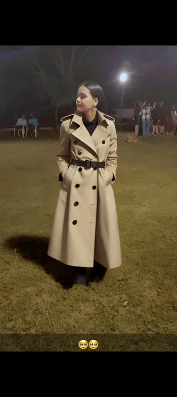 Person In Beige Trench Coat