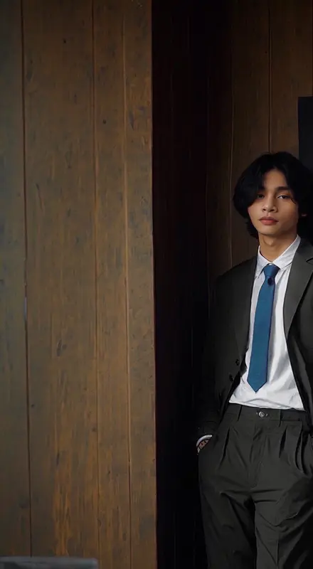 Person In Suit Leaning