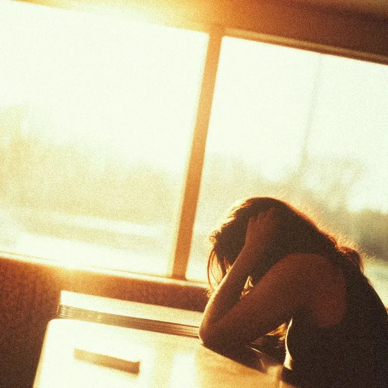 Person Sitting In Sunlight