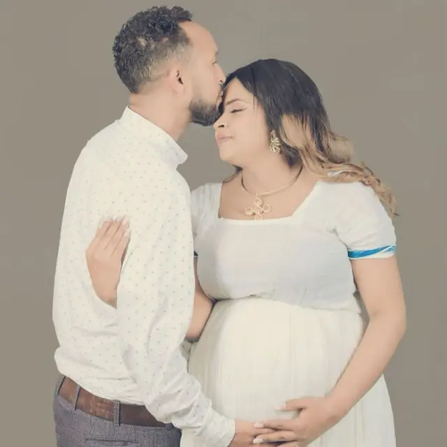 Pregnant Couple's Affectionate Embrace