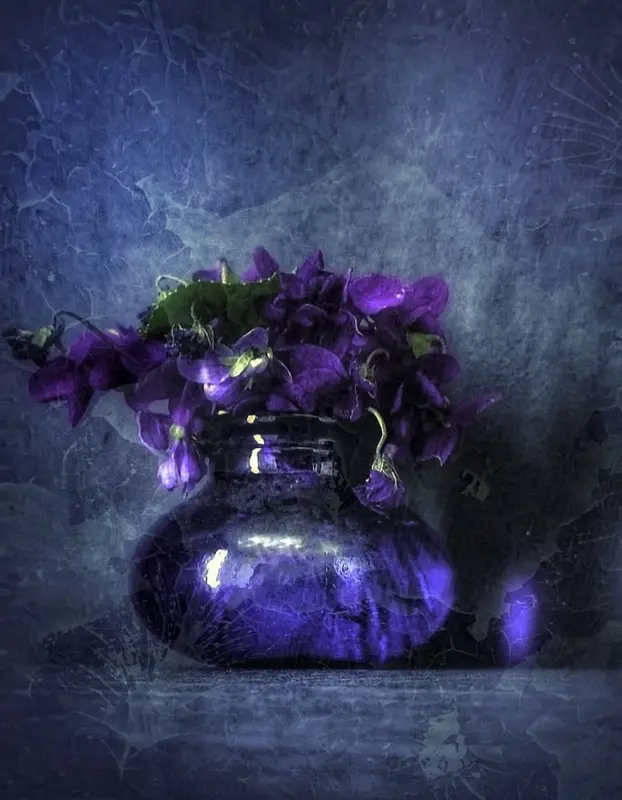 Purple Flowers In Glass Vase