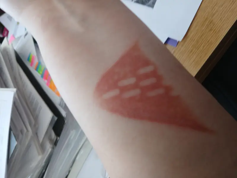 Reddish Triangular Arm Mark