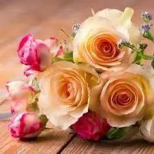 Rose Bouquet On Wooden Surface