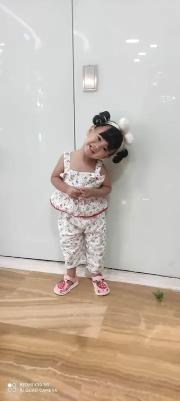 Smiling Girl In Matching Outfit