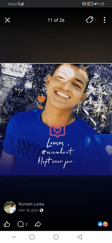 Smiling Individual in Blue Shirt