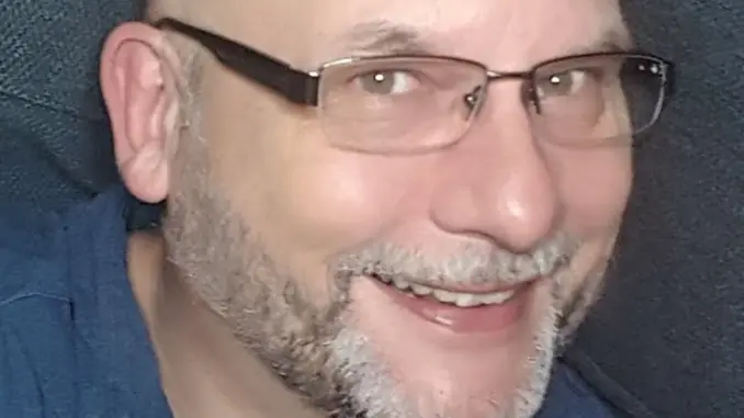 Smiling Man With Glasses