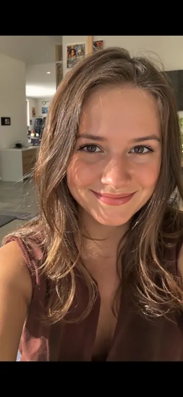 Smiling Woman In Sunlit Room
