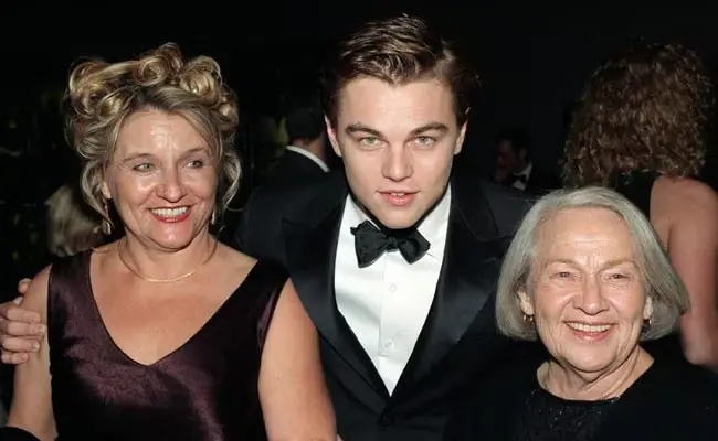 Three Adults In Formal Attire