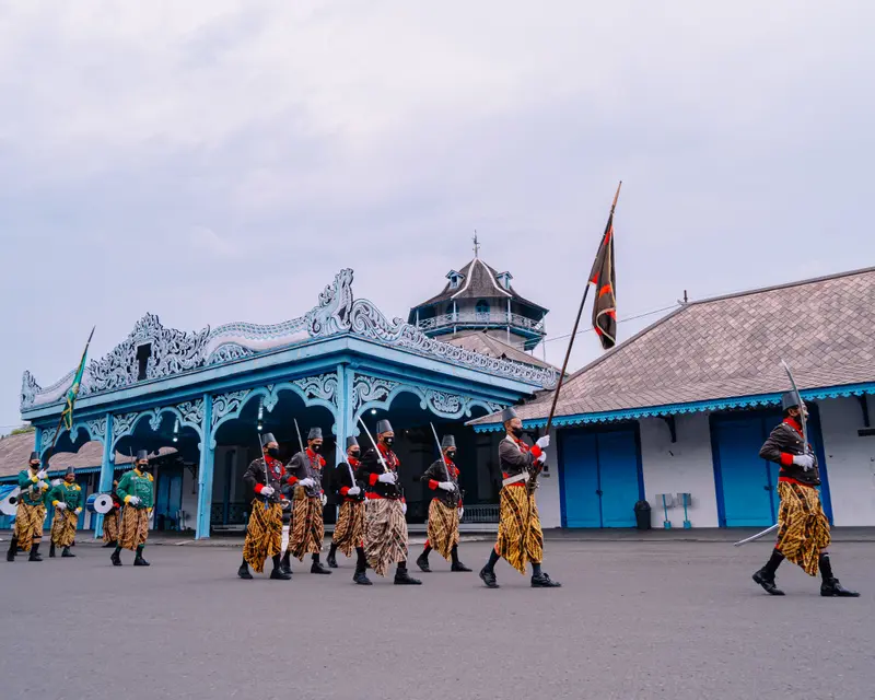 Traditional Parade Before Historic Structure
